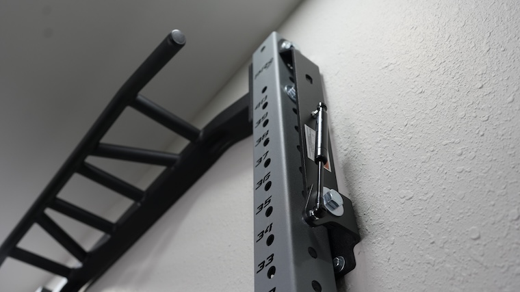 The PRx Performance Profile PRO Folding Squat Rack in storage