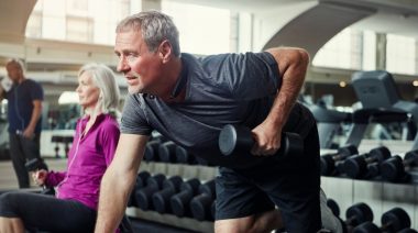 A person performing the dumbbell row exercise.