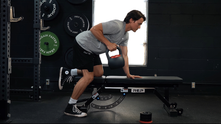 Our tester doing rows with the REP Fitness Adjustable Kettlebell.