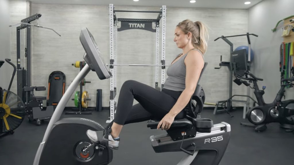 A BarBend tester using the NordicTrack Commercial R35 exercise bike.