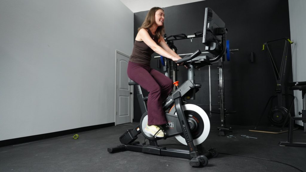 Our tester is shown riding the NordicTrack S22i exercise bike.