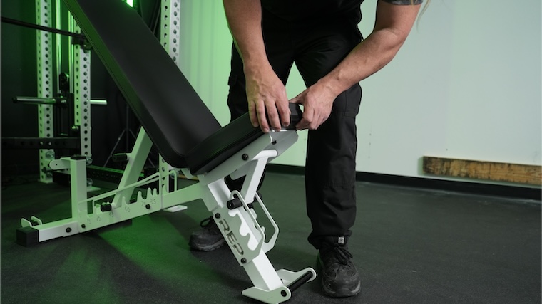 Our tester adjusting the REP Fitness AB-4100 seat