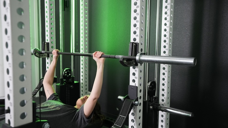 Our tester setting up for a bench press in the REP Fitness PR-5000 Power Rack.