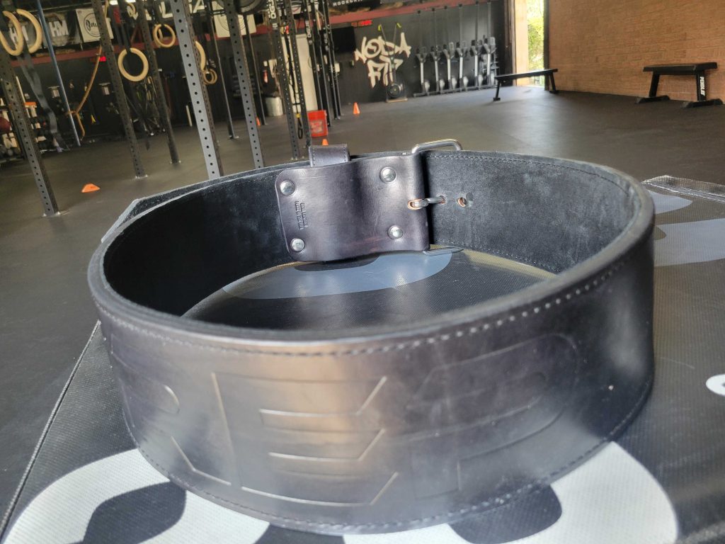 The REP Fitness Premium Leather Lifting Belt in the BarBend gym.