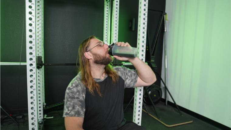 Our tester drinking Transparent Labs Prebiotic Greens.