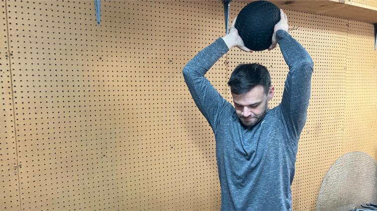 BarBend reviews writer Matt Cummings with the TRX Slam Ball.