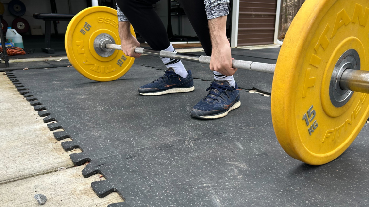 A BarBend tester using Living.Fit workout mats.