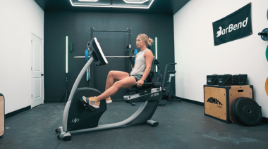 An athlete riding the NordicTrack Commercial R35 Recumbent Bike