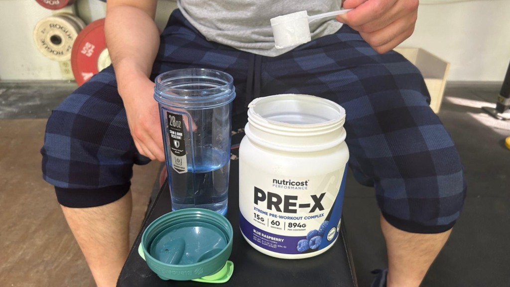 Our tester sampling Nutricost Pre-X Pre-Workout.