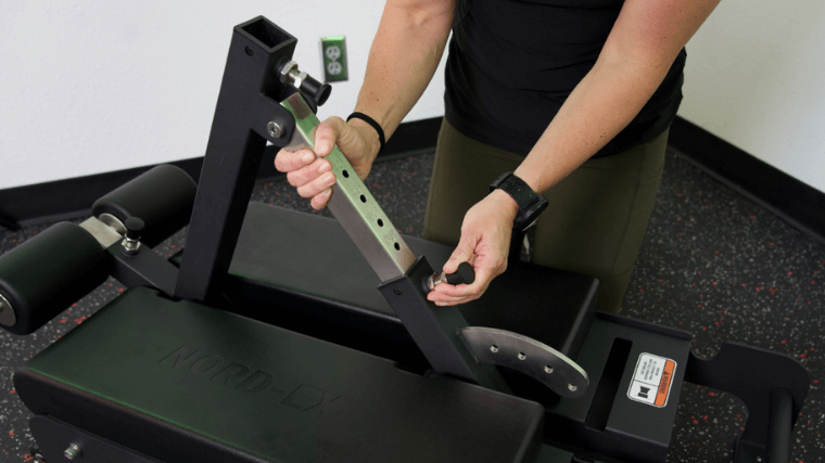 A BarBend tester adjusting the angle of the Shogun NORD-EX.