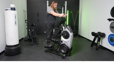 A person works out on the Bowflex Max Trainer M6 elliptical.